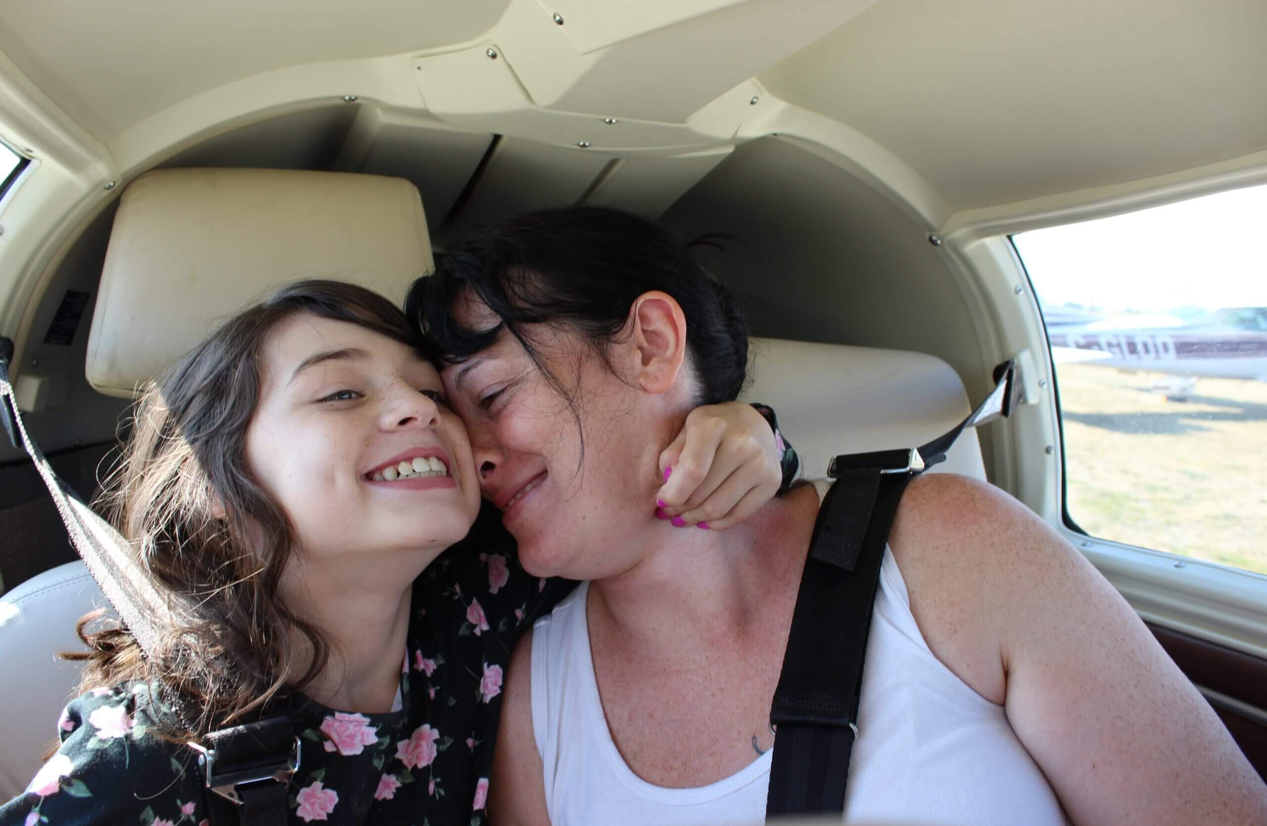 Mom and daughter happily travelling together