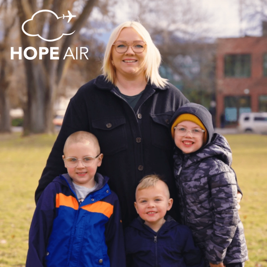A family of a mother and 3 young boys
