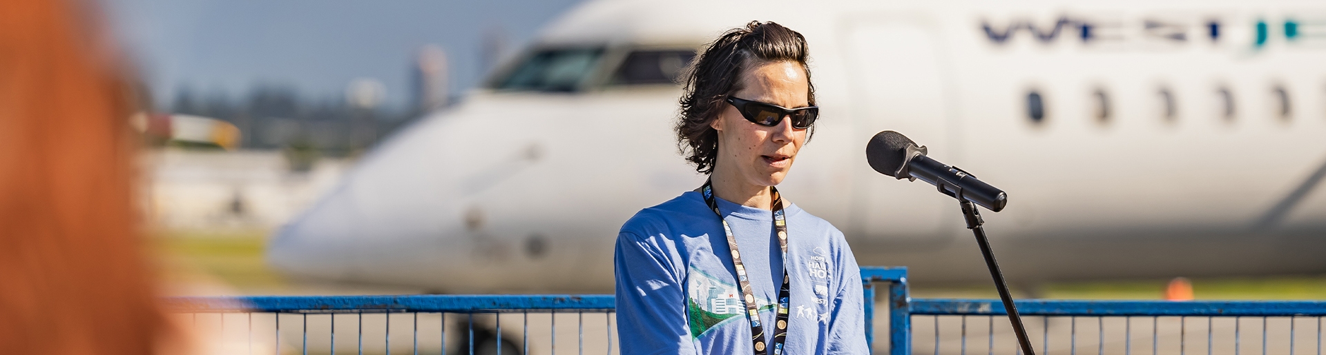 A woman giving a speech at a podium