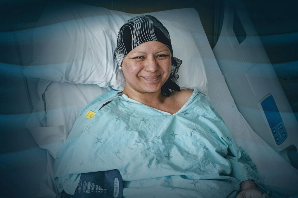 Smiling woman lying on a hospital bed