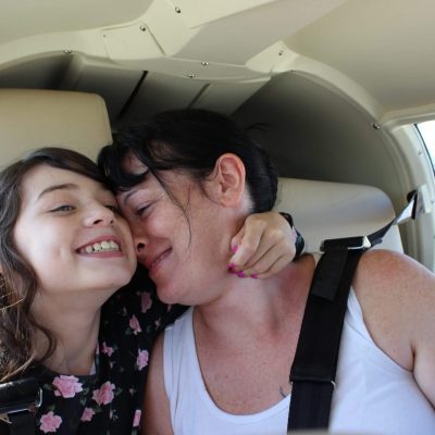 Mom and daughter happily travelling together