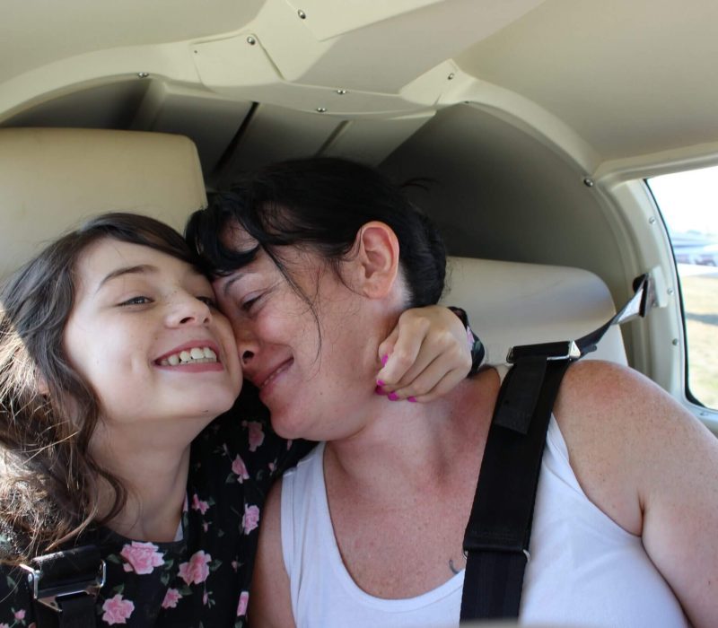 Mom and daughter happily travelling together